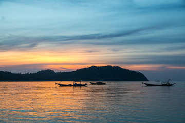 Fishermen boat at sunset near Koh Phangan island, Thailand
