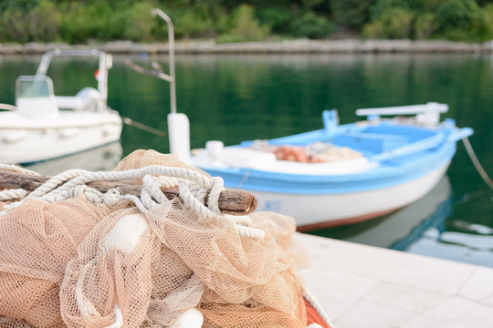 Fishnet and blue small boat