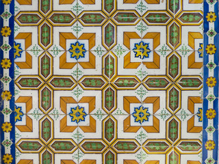 Beautiful vintage orange, yellow and green portuguese tiles (azulejos) in Lisbon