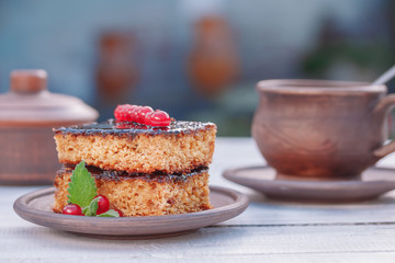 Tasty chocolate cake with berries on table close up