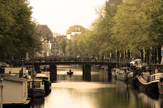 Old city houses along canal in Amsterdam, Holland