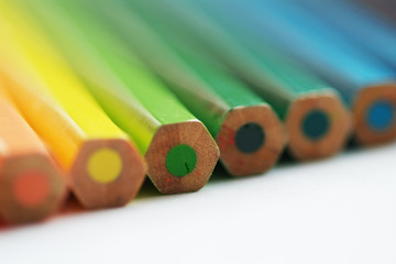 Blurry cold colors pencils with fuzzy edges on white background. Diagonal close up view