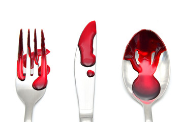 fork and spoon with blood on white background