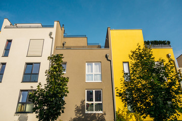 beautiful townhouses with green trees