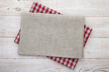 Fototapeta premium Napkin on table in perspective. Napkin close up top view mock up for design. Place for text