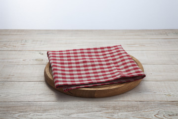 Napkin. Stack of colorful dish towels on white wooden table background top view