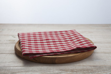 Napkin. Stack of colorful dish towels on white wooden table background top view