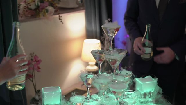 Pyramid of glasses with champagne with led light