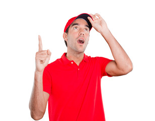 Naklejka premium Surprised delivery man pointing up