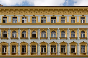 Obraz premium Facade of a building, windows, yellow walls