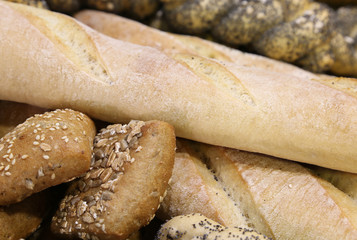 pieces of fresh bread in the bakery with fragrant loaves and bag
