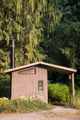 Outhouse in the woods for campers.