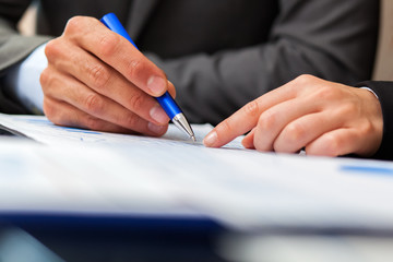 Closeup of business people working in an office