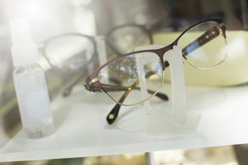 Pair of classic metal-framed glasses in a shop window.