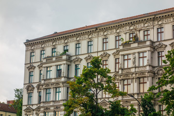Fototapeta na wymiar white apartment building with ornaments