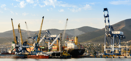 Cargo ship with crane over sea