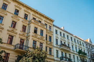 Fototapeta na wymiar yellow and white apartment buildings in a row