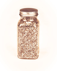 pepper spice in glass container isolated