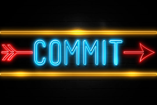 Commit  - fluorescent Neon Sign on brickwall Front view