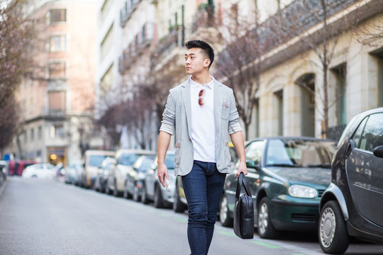 Chinese businessman walking down the street