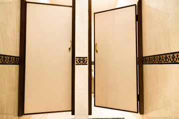 Public mans toilet cabins door in hotel