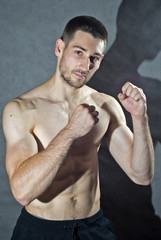 Portrait of young male body-builder