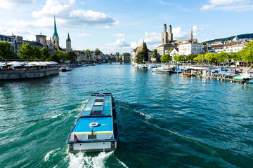 zurich inner city view with boat on water and historic site - obrazy, fototapety, plakaty