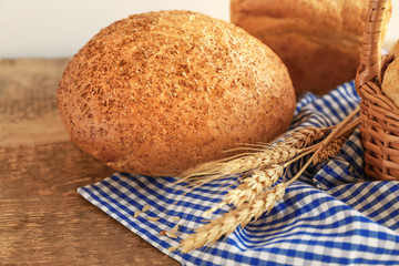 Delicious bread on wooden table