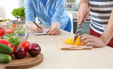 Chef giving cooking classes in kitchen