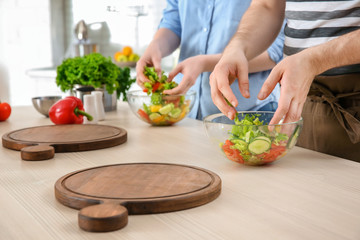 Chef giving cooking classes in kitchen