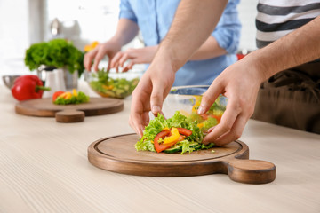 Chef giving cooking classes in kitchen