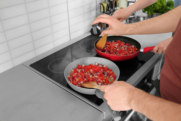 Chef giving cooking classes in kitchen