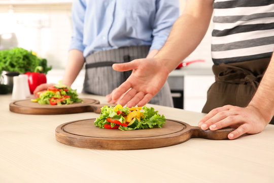 Chef giving cooking classes in kitchen