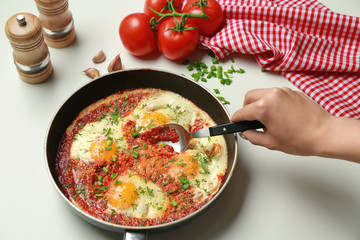 Woman eating eggs in purgatory