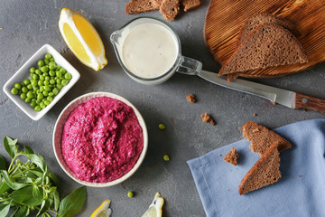 Bowl of fresh beet hummus on table