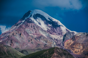 Mount Kazbek view from Stepantsminda town in Georgia in good weather for climbing. It is a dormant stratovolcano and one of the major mountains of the Caucasus.