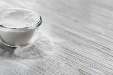 Glass bowl of baking soda. Spoonful of bicarbonate. Baking soda, Sodium bicarbonate, NaHCO3