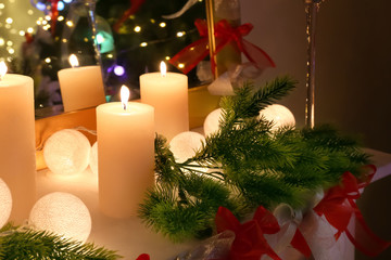 Beautiful Christmas decorations on shelf in living room