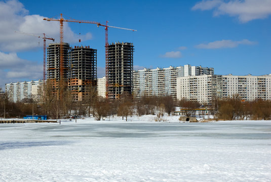 Buildings under construction in winter sunny day