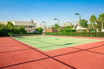 Foto auf Acrylglas Beautiful tennis court in sunny day © Africa Studio