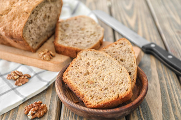 Sliced banana bread with nuts on table