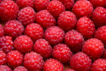Raspberry organic background. Fresh raspberries from village garden. Ecological berries for desserts, cakes, smoothie or jam.
