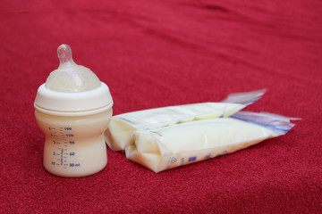 breast milk in baby bottle and storage bags