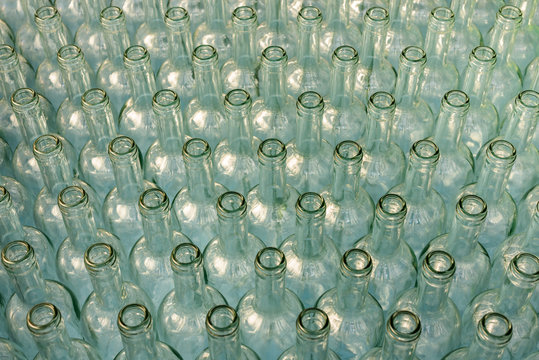 Many empty bottles of vine in a row, for background. Bottles in Row.