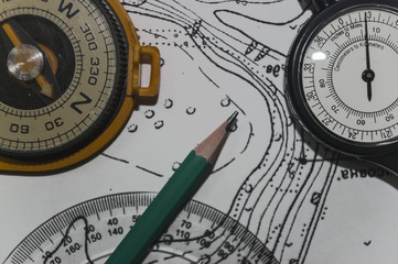 Compass a metre of curves and pencil on topographic map 1