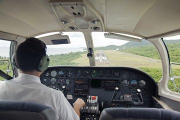 Interior shot of a plane cockpit landing  - obrazy, fototapety, plakaty