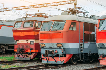 Obraz premium Electric locomotives are lined up on the railway