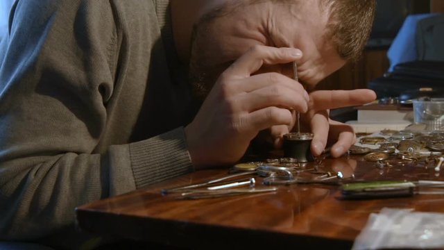 watchmaker clockwork repairs in the workshop