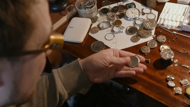 watchmaker clockwork repairs in the workshop