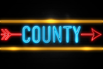 County  - fluorescent Neon Sign on brickwall Front view